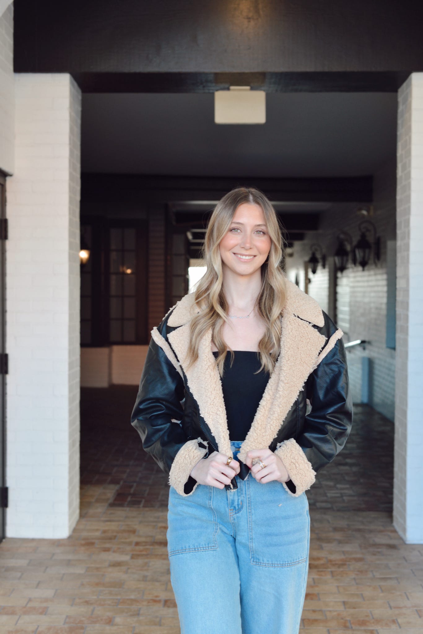 BLACK FAUX LEATHER AND SHERPA JACKET