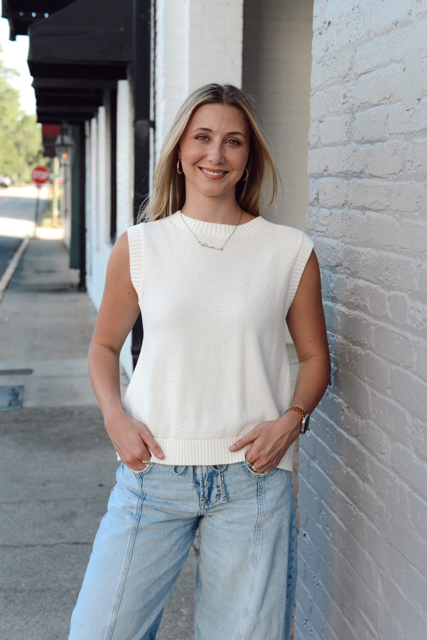 SLEEVELESS TIE BACK SWEATER