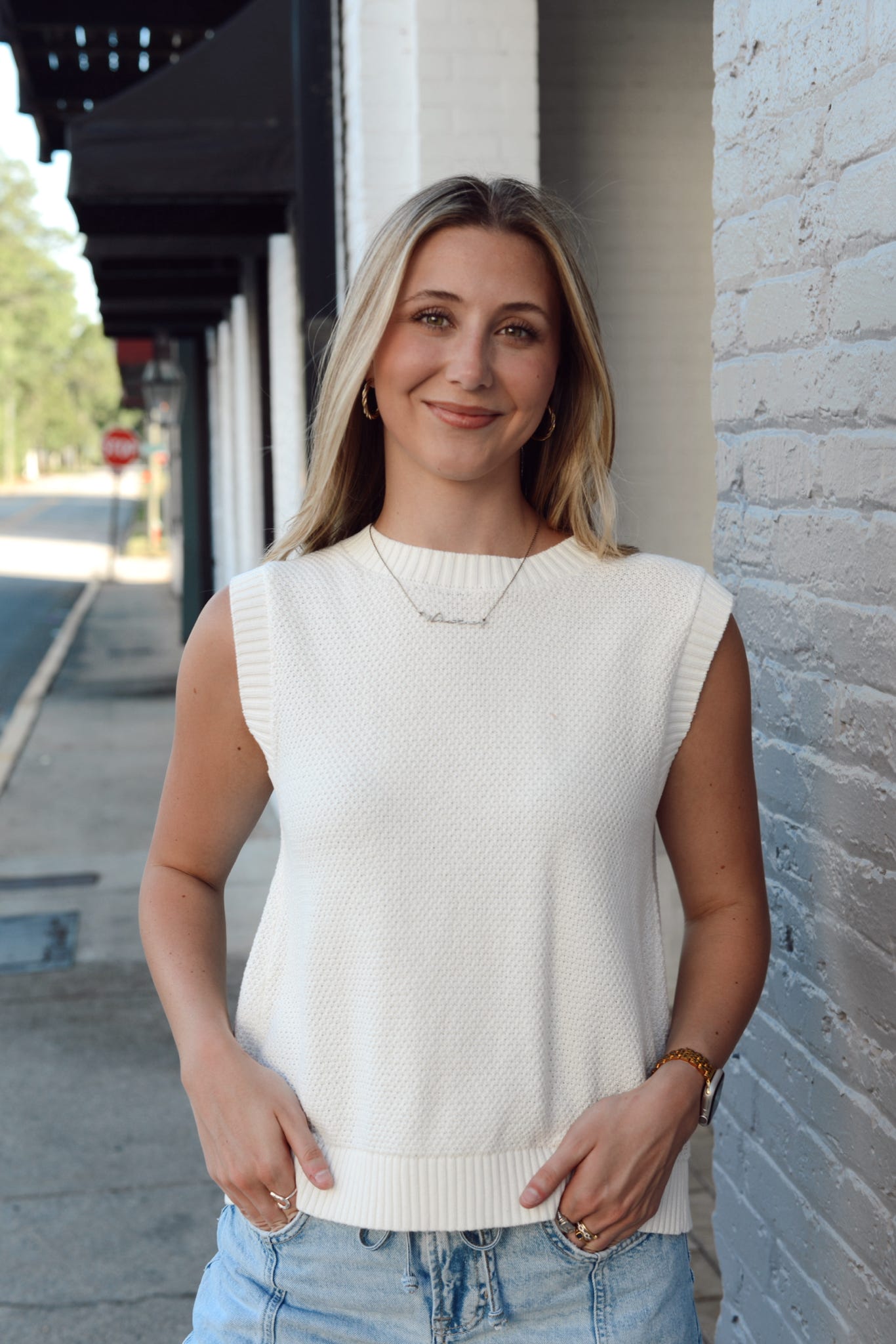 SLEEVELESS TIE BACK SWEATER
