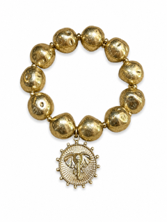 A gold beaded bracelet featuring irregular, polished gold beads and a dangling circular medallion charm with an elephant head, shown on a plain white background.