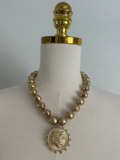 GOLD BEAD NECKLACE WITH TIGER PENDANT