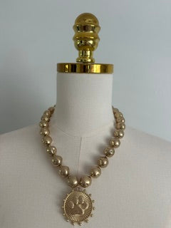 GOLD BEAD NECKLACE WITH PAW PENDANT